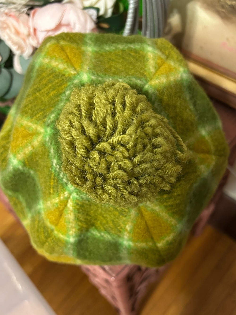 green felted beret features a vibrant plaid wool, medium